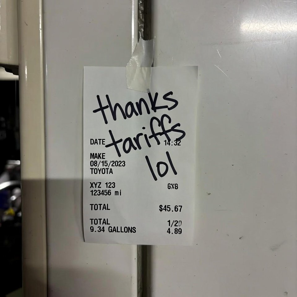 Crooked gas receipt taped to fridge, "thanks tariffs lol" note.
