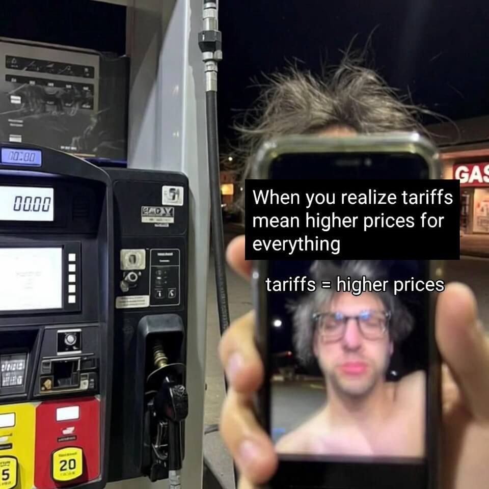 Exhausted selfie at gas pump with "tariffs = higher prices" meme on phone.